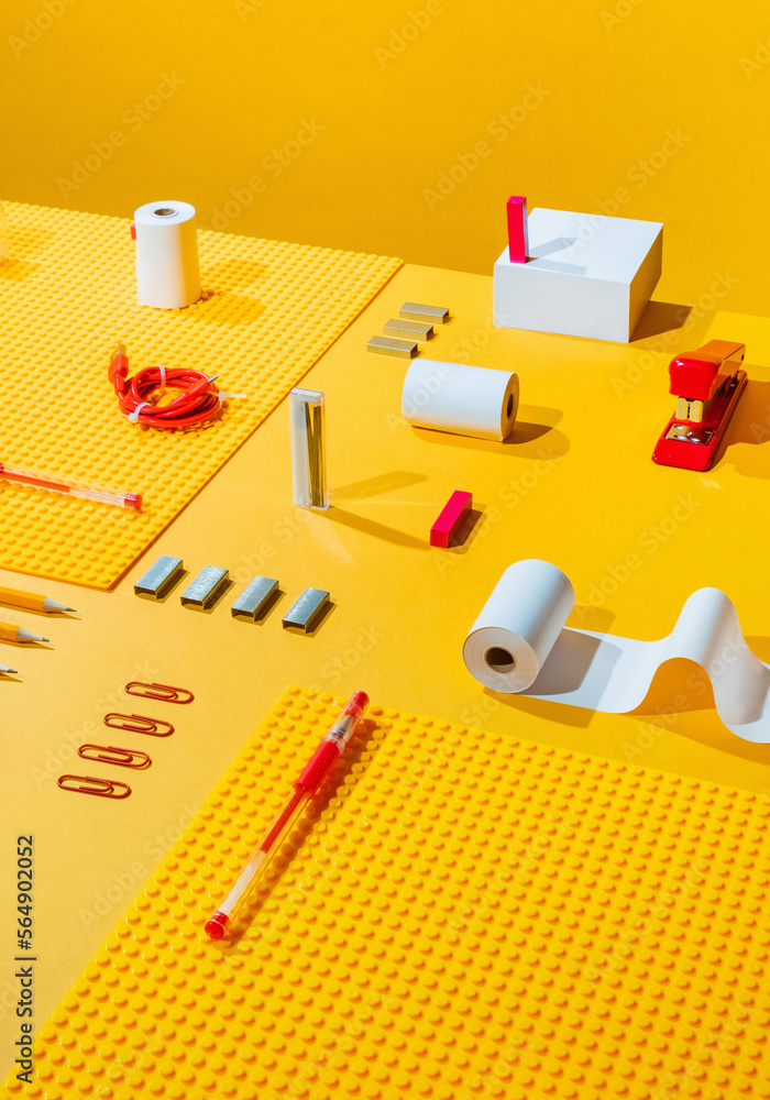 Office supplies on yellow table Office supplies on yellow table