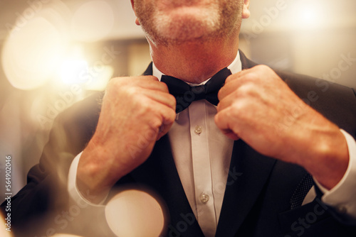 Hands, fix bowtie and tuxedo for party, event or celebration gala in night for formal fashion. Senior man, evening clothes and designer suit by blurred background to ready for new years eve in mirror