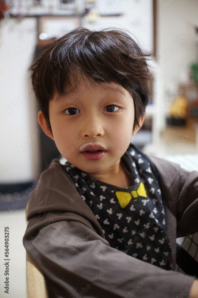 Asian little boy, just finished drinking milk Asian little boy, just finished drinking milk