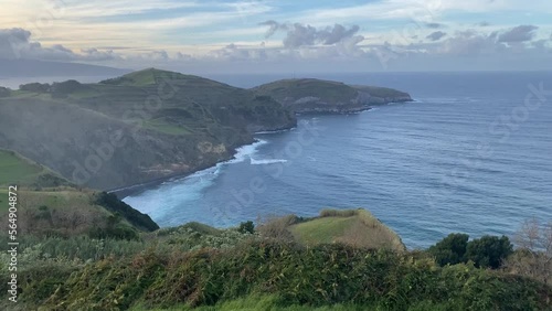 Azores volcanic islands. Ocean view from top. Blue waves and ripid shore cliff photo