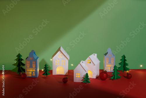 Handmade small white cardboard houses in Christmas theme