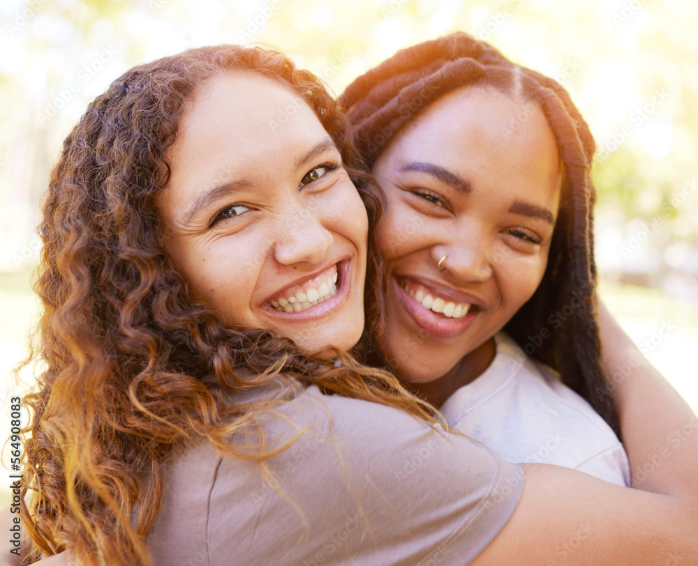 Obraz premium Young women and friends hug portrait for togetherness at park for bonding, wellness and happiness. Gen z, youth and natural black people with happy smile and embrace on summer hangout in nature.