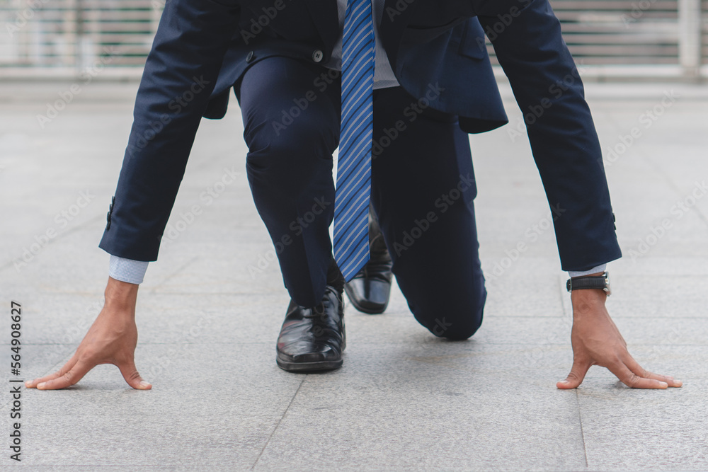 Businessman set in start running position prepare to fight in business race. Businessman set in start running position prepare to fight in business race.