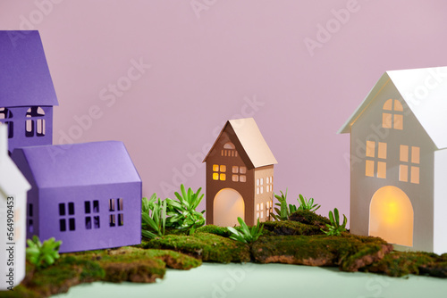 Mini paper down town on small island with illuminated windows