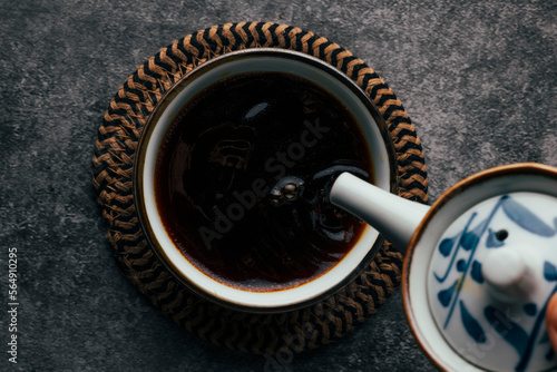 Jar pouring soy sauce photo