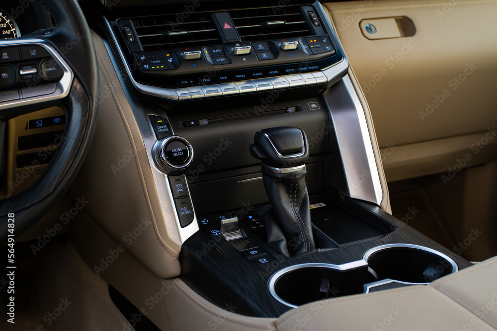 Close up of the modern automatic gearbox lever. Automatic transmission shift selector. Gear selector close up. Close up of the modern automatic gearbox lever. Automatic transmission shift selector. Gear selector close up.