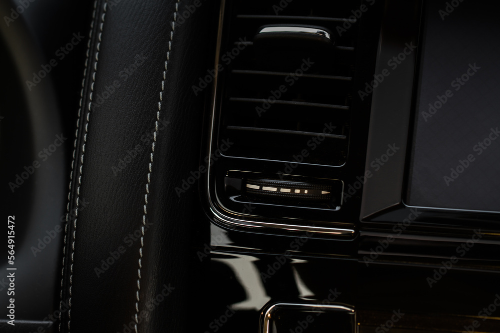 Car air conditioning close up view. The air conditioner flow inside the car. Detail interior of car. Air ducts.