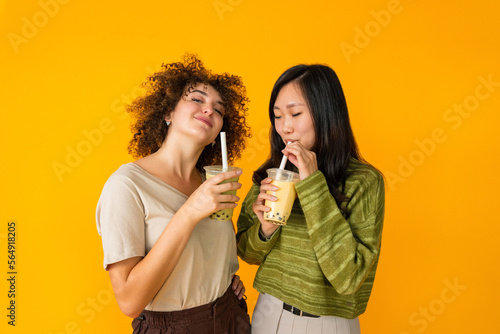 Diverse women drinking bubble tea photo