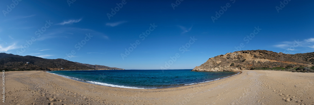 Panoramic view of the amazing golden sand and turquoise waters at the beautiful beach of Kalamos in Ios Greece