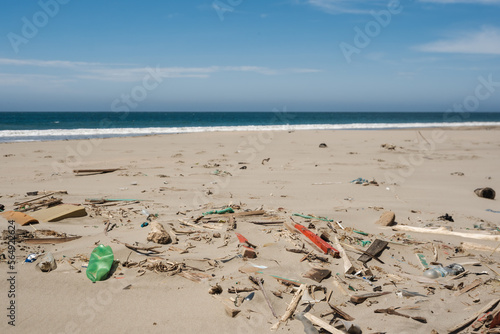 sand beach full of trash photo