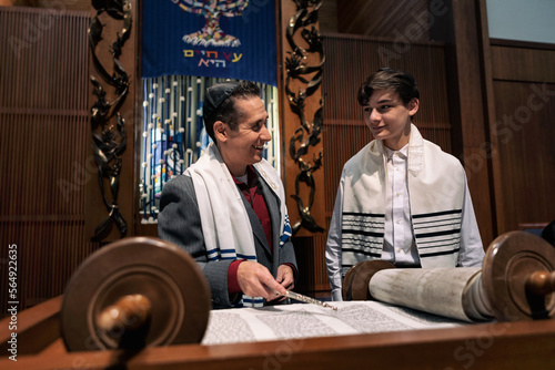 Synagogue: Rabbi Working With Male Teen On Torah Portion
