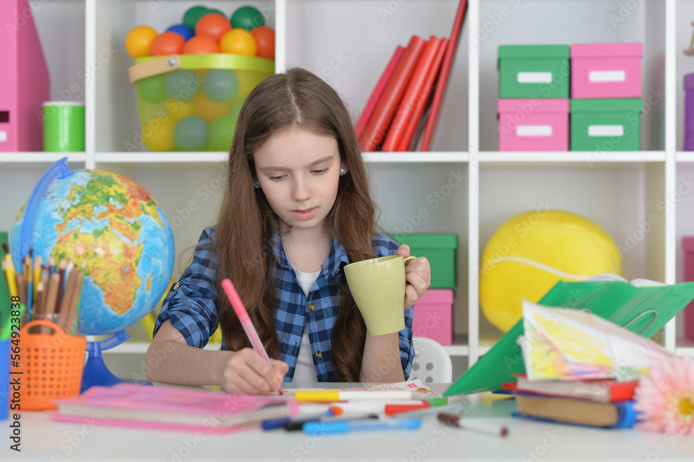 cute girl doing home work at desk cute girl doing home work at desk