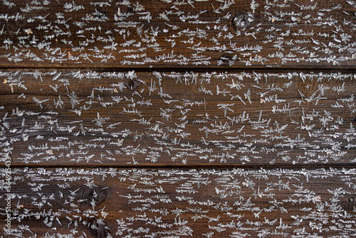 Texture Of Wooden House Wall With Frozen Snowflakes photo