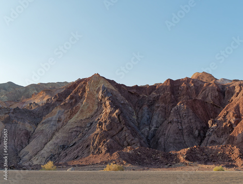 View of amazing colored mountains from a road toward the Dasht-e Lut desert in Iran