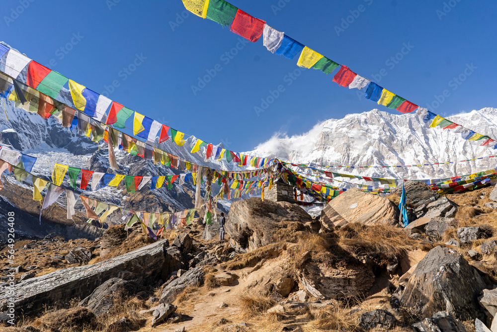 Snowcapped mountains and Tibetan  flags of prayers in the Himalaya
