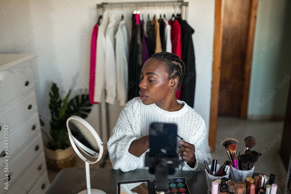 black woman blogger doing makeup at home black woman blogger doing makeup at home