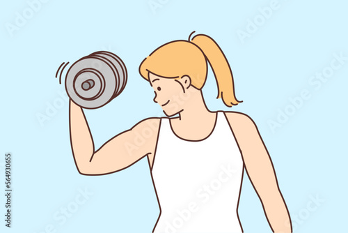 Young woman exercising with dumbbells