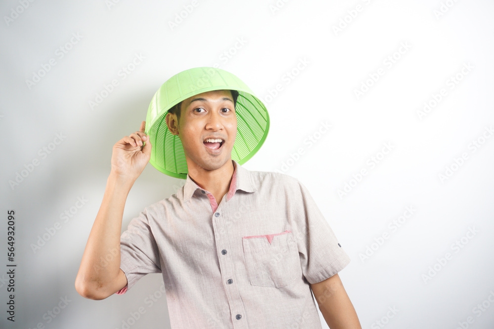 handsome asian man acting or posing silly with serving hood handsome asian man acting or posing silly with serving hood