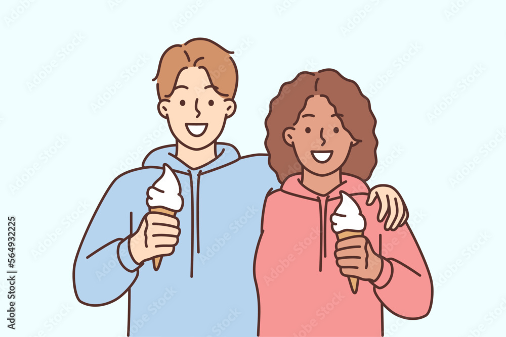 Smiling interracial couple hug eat ice cream Smiling interracial couple hug eat ice cream
