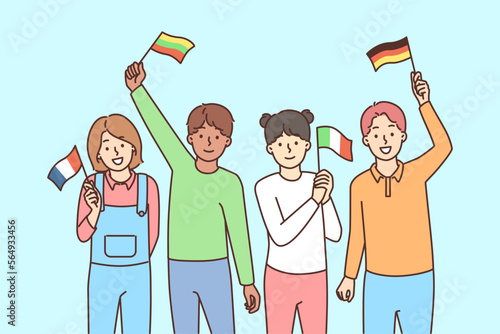 Smiling children with countries flags in hands 