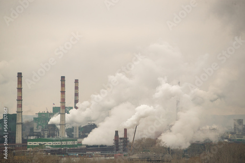 Factory or refinery. Smoke from factory chimneys. Industry concept. Environmental pollution.