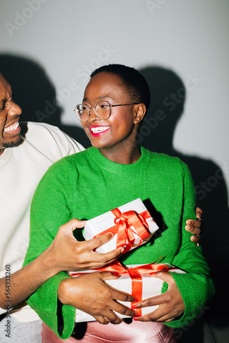 Couple Exchanging Christmas Presents 
