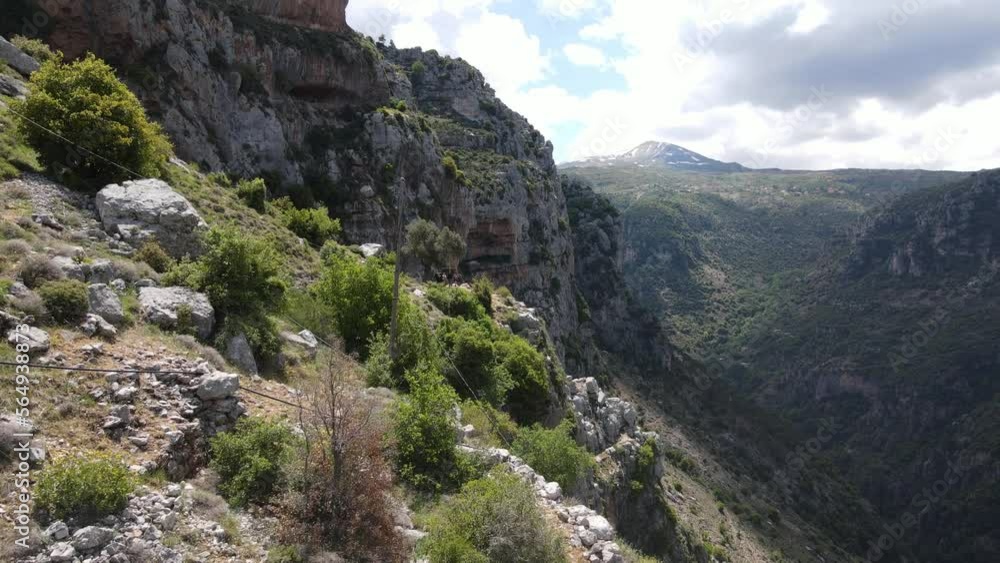 Drone Shot of Qadisha Valley, Lebanon. Flying Above Cliffs and Rocky Hills on Summer Day Drone Shot of Qadisha Valley, Lebanon. Flying Above Cliffs and Rocky Hills on Summer Day