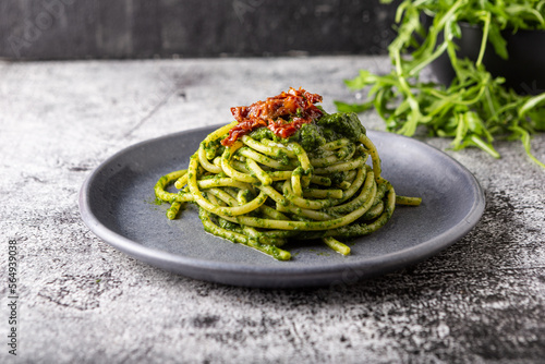 Gragnano spaghetti with homemade rocket pesto and dried tomatoes. Dish suitable for adults and children, healthy and tasty.