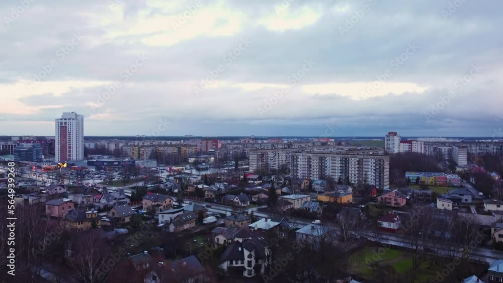 Aerial drone shot of Darzciems district residential with busy road, above trees Aerial drone shot of Darzciems district residential with busy road, above trees