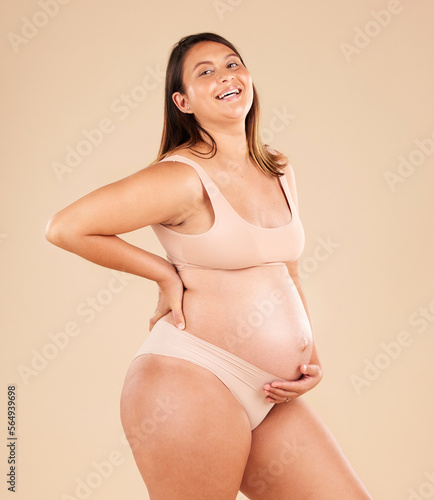 Laughing, body or holding pregnancy stomach in underwear on studio background protection, woman love or baby support. Smile, happy or funny pregnant mother with belly or joke on mock up