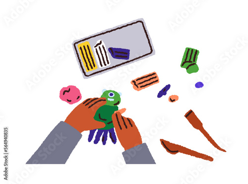 Childs hands with plasticine, above top view. Black kid making, modeling figu...
