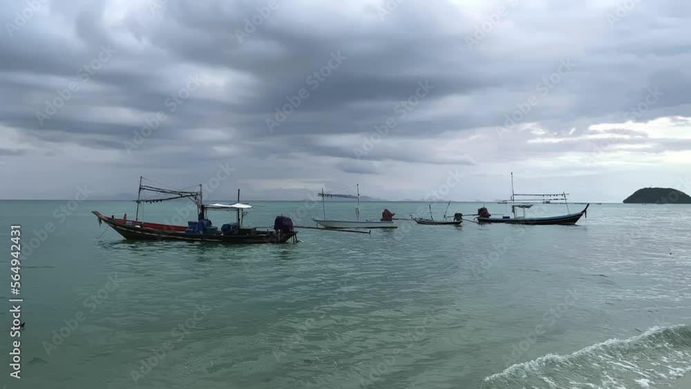 Fishing boats in the sea at the pier in cloudy cloudy weather. The Gulf of Thailand is part of the South China Sea, washing the southwestern coast of Thailand. High quality 4k footage Fishing boats in the sea at the pier in cloudy cloudy weather. The Gulf of Thailand is part of the South China Sea, washing the southwestern coast of Thailand. High quality 4k footage