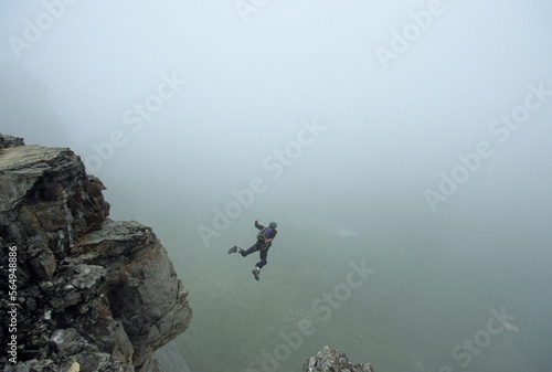 Man basejumps into fog, Canada. photo