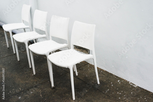 White chairs on the pavement photo