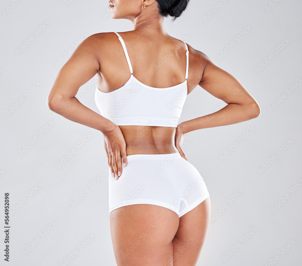 Fototapeta premium Body, wellness and back of woman after fitness exercise, workout and training to lose weight in studio. Motivation, self care and female model for cellulite treatment, diet and healthy lifestyle