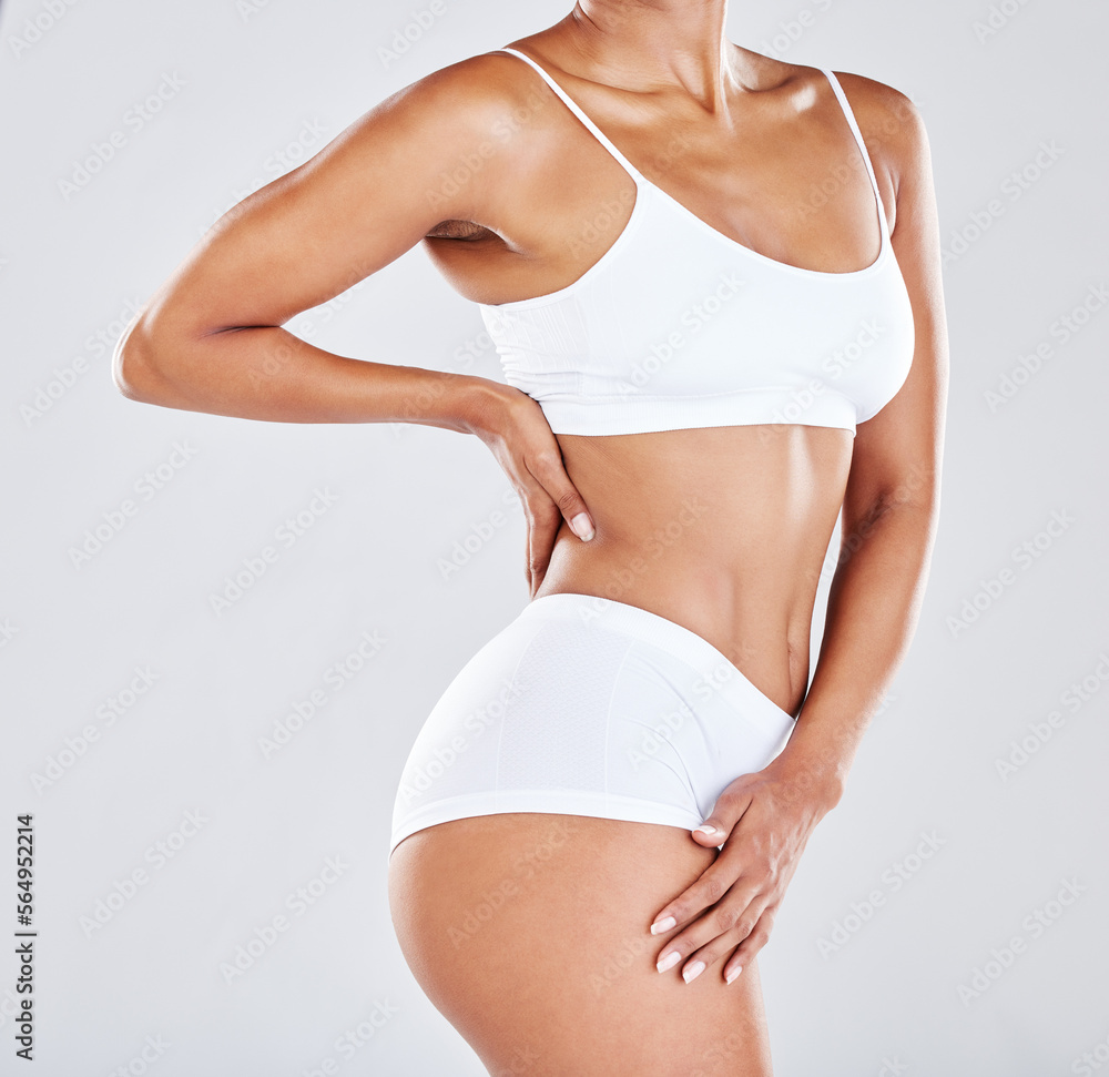 Fitness, wellness and stomach of woman in studio after workout, exercise and training to lose weight. Slim body, skincare and abdomen of female model for nutrition, diet routine and healthy lifestyle