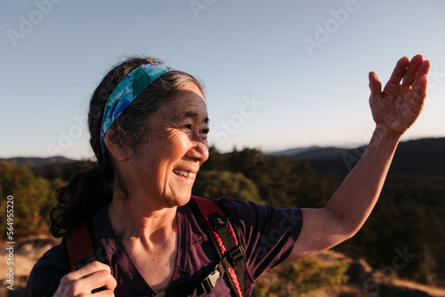 Woman looking at the morning view on a mountain top.