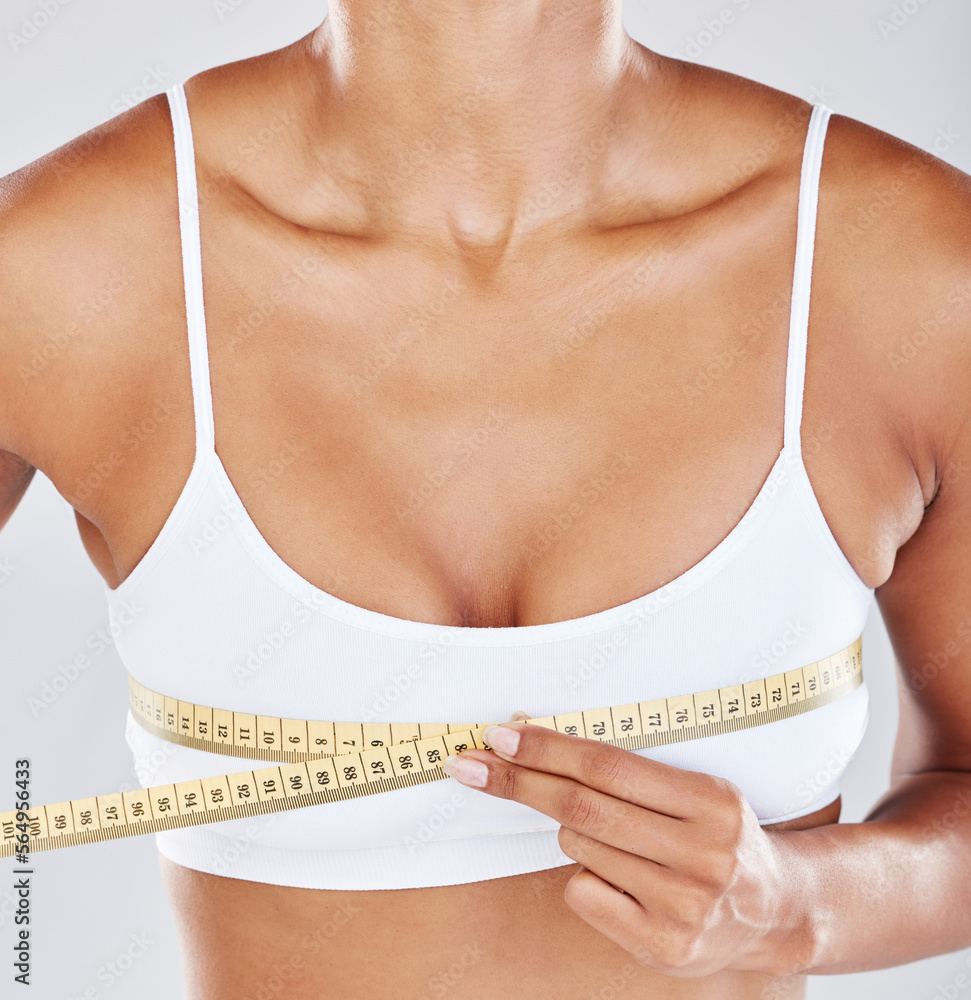 Chest, measure tape and woman isolated on white background for breast  cosmetics, plastic surgery and lose weight. Liposuction, health or wellness  person or model with boobs for beauty results in zoom Photos