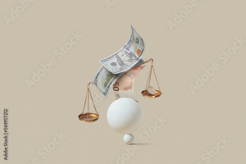 Dollar and Euro with scale balancing on spheres. photo