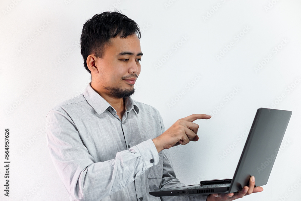 Handsome young ambitious developer working alone at the office Handsome young ambitious developer working alone at the office