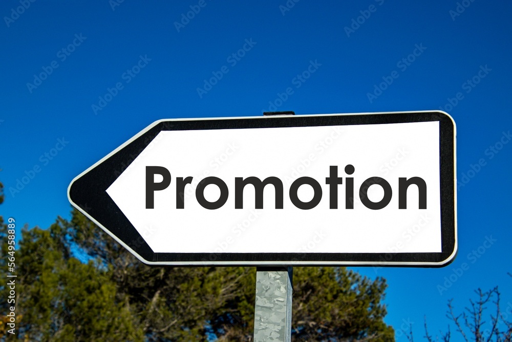 the word 'promotion' written on a road sign