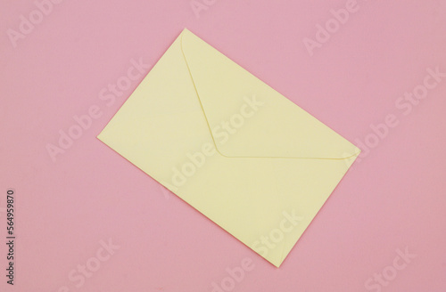 One mail envelope on pink background.