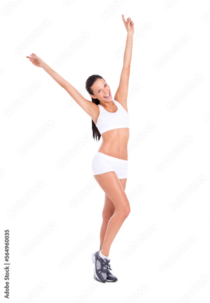 A fit young woman in exercise clothing raising her arms in celebration isolated on a PNG background.