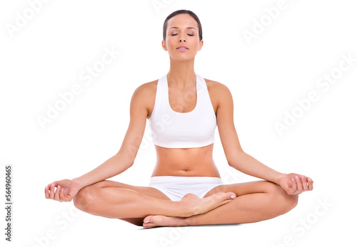 A young woman practicing yoga sitting in the lotus position isolated on a PNG background.