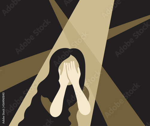 Shy woman spotlight and covers herself