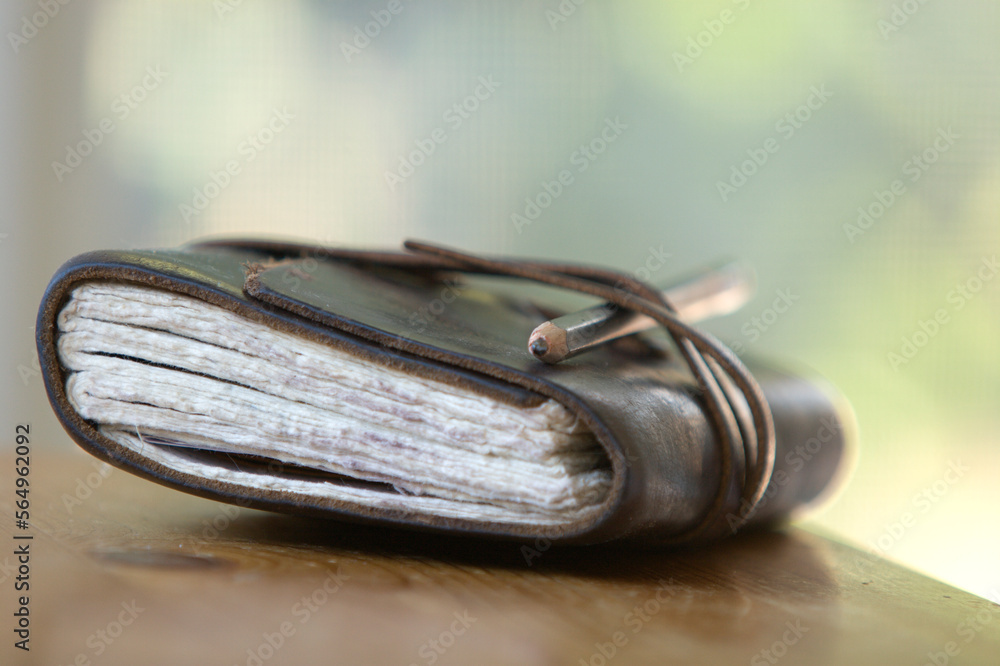 Still life of journal and pencil. Still life of journal and pencil.