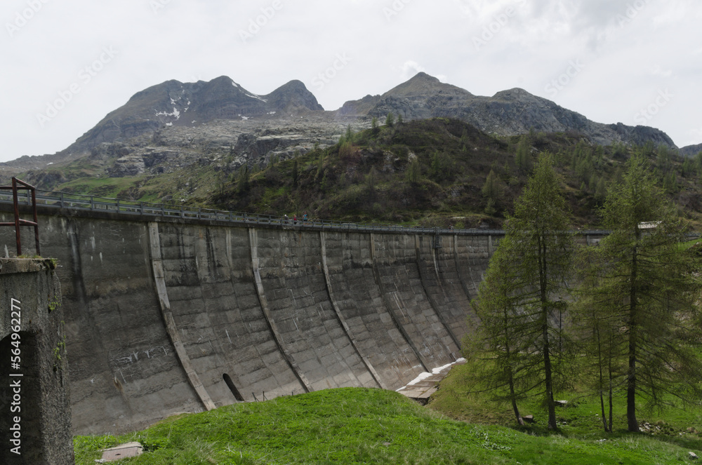 Hydroelectric dam next mountain lake Laghi Gemelli. Orobie ( Bergamasque Alps ), Italy