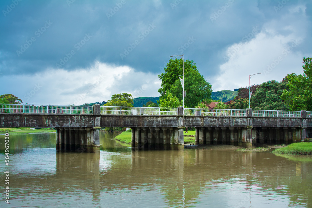 Historical road bridge over Taruheru River on a stormy day. Gisborne, North Island, New Zealand