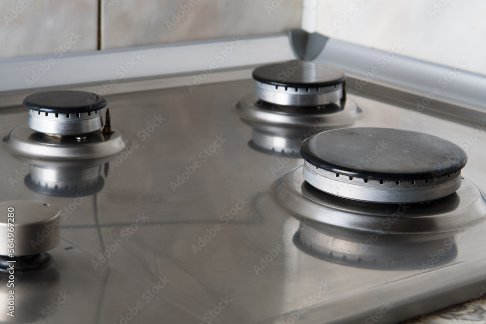 Obraz premium burning gas in a gas stove, close-up of the burner, gas crisis, high gas bills