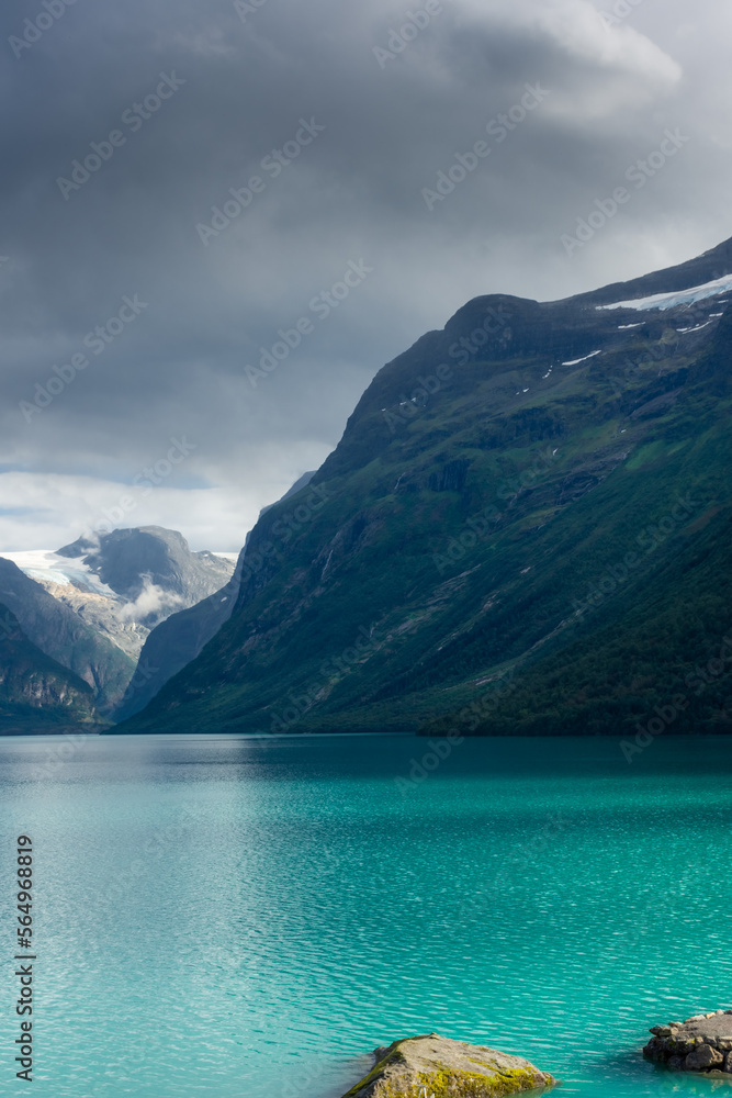 Landscape of the Lovatnet glacial lake with turquoise crystal clear water,  Norway